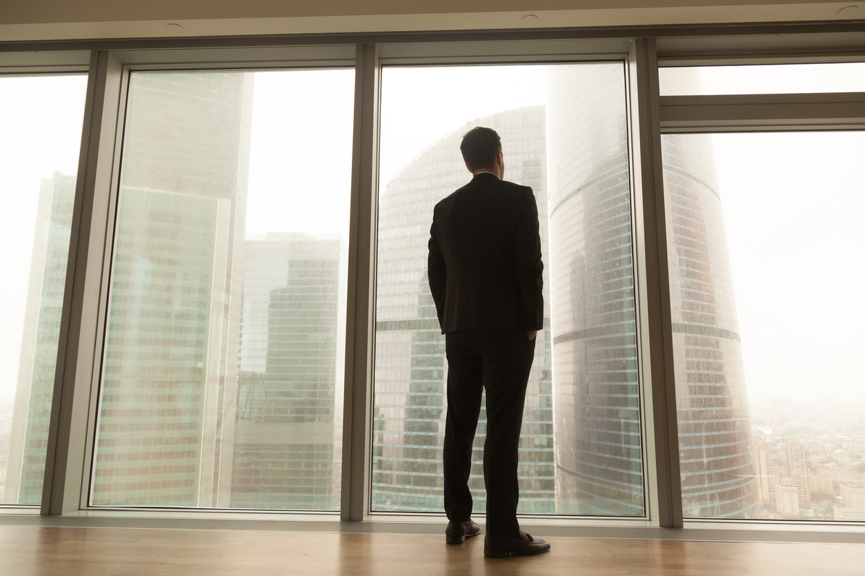 CEO standing at a window