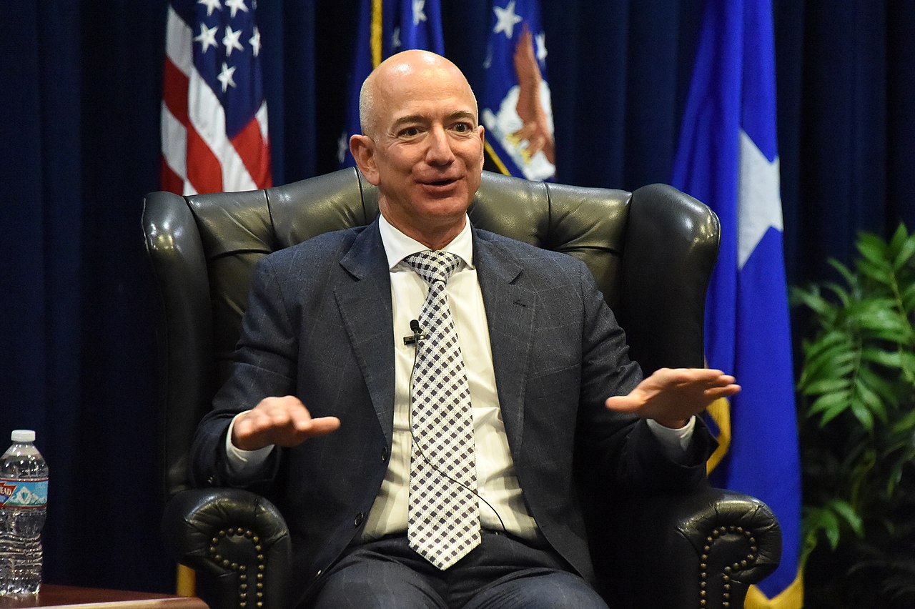 Jeff Bezos sitting in an armchair