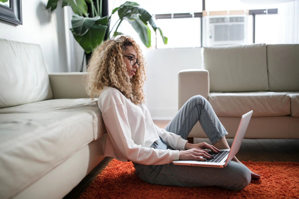 Young woman working from home on a laptop