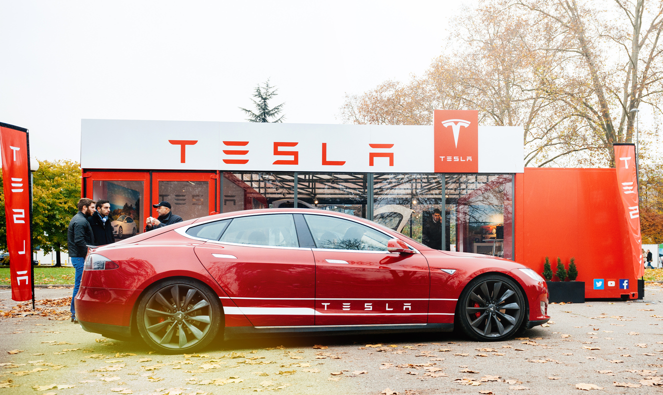 Tesla Model S parked in front of showroom