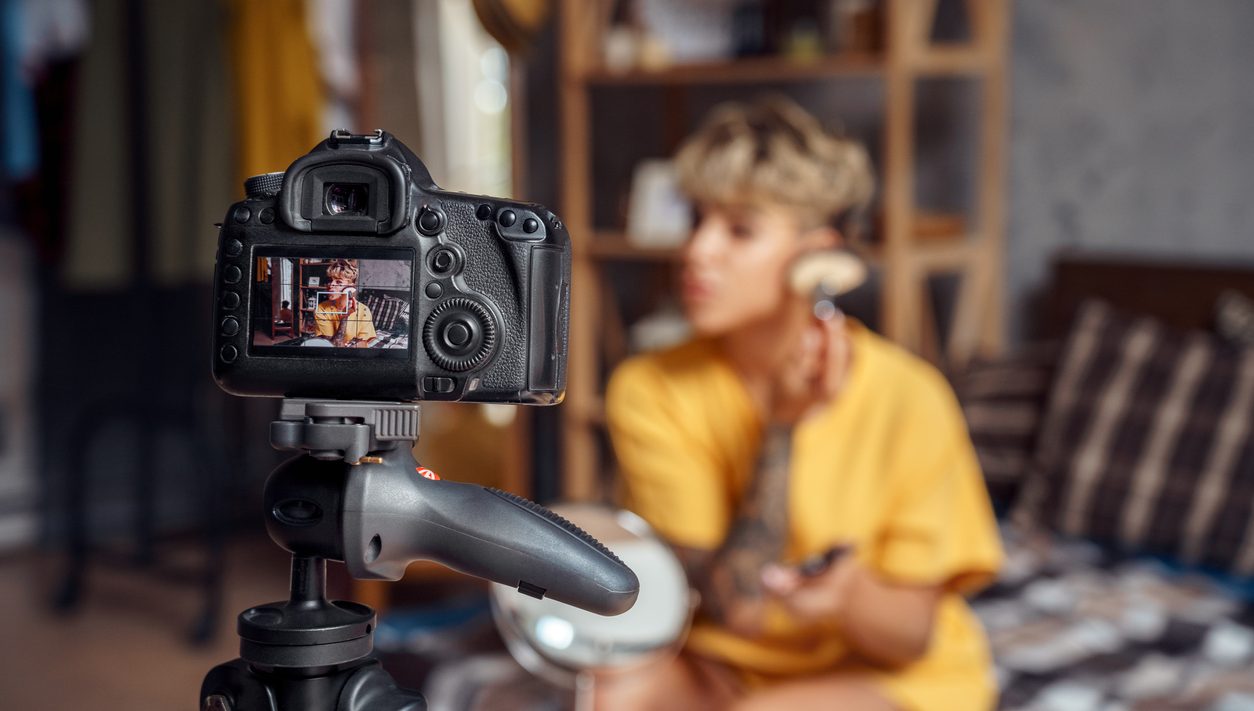 Influencer applying makeup on camera