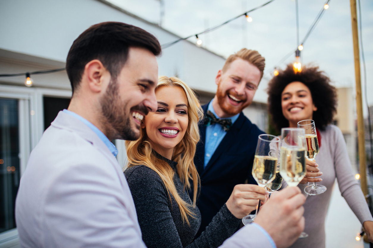 Affluent young people toasting with champagne