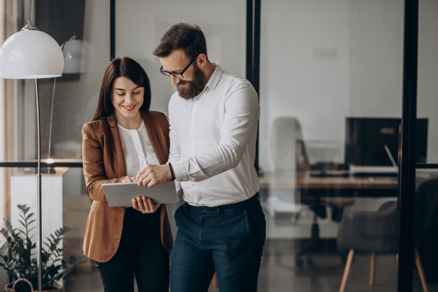 Entrepreneur couple looking at tablet