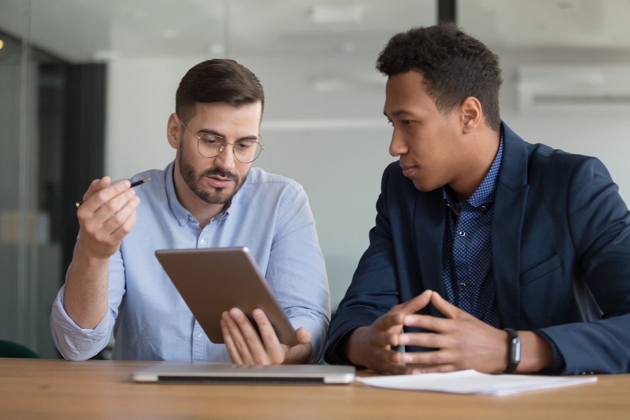 Two friends in a business meeting