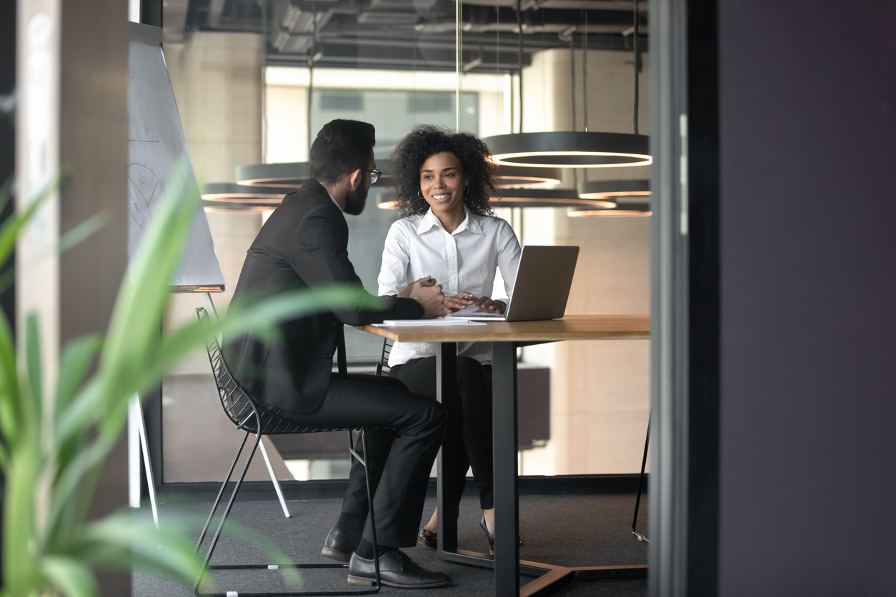 Employee and employer in meeting