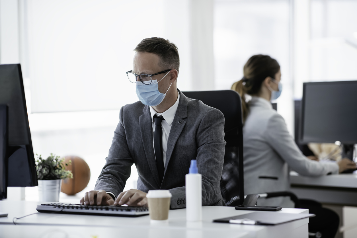 Employees working in office during coronavirus crisis