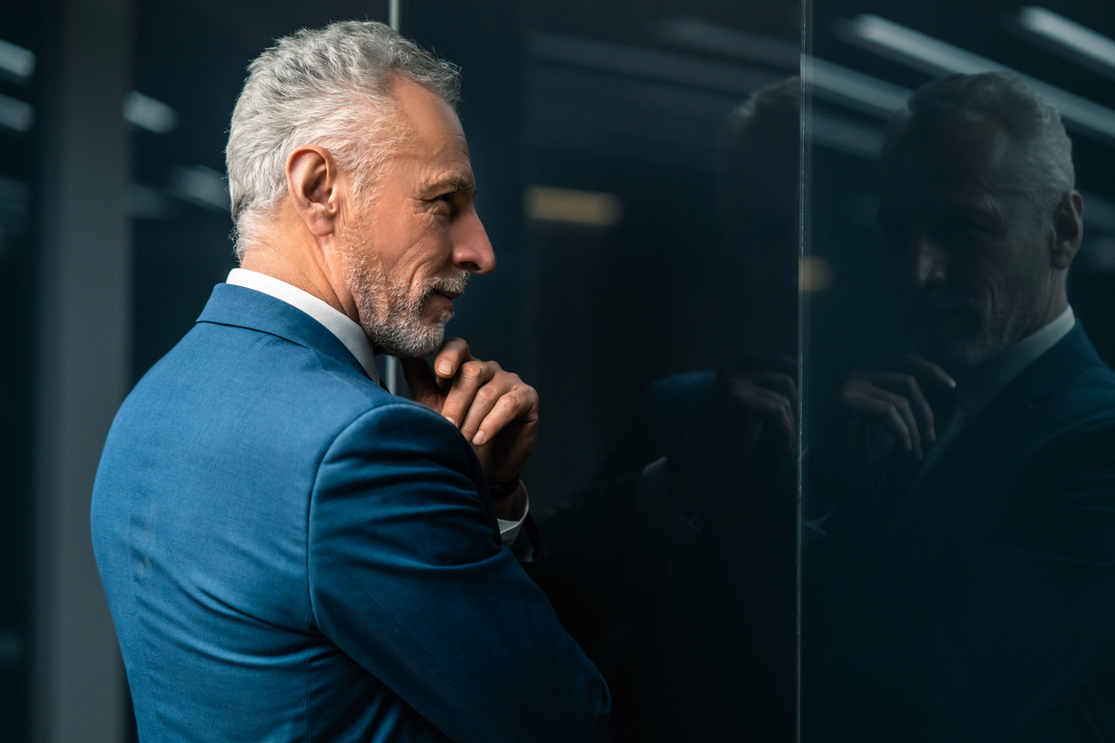 Businessman standing in workplace doorway