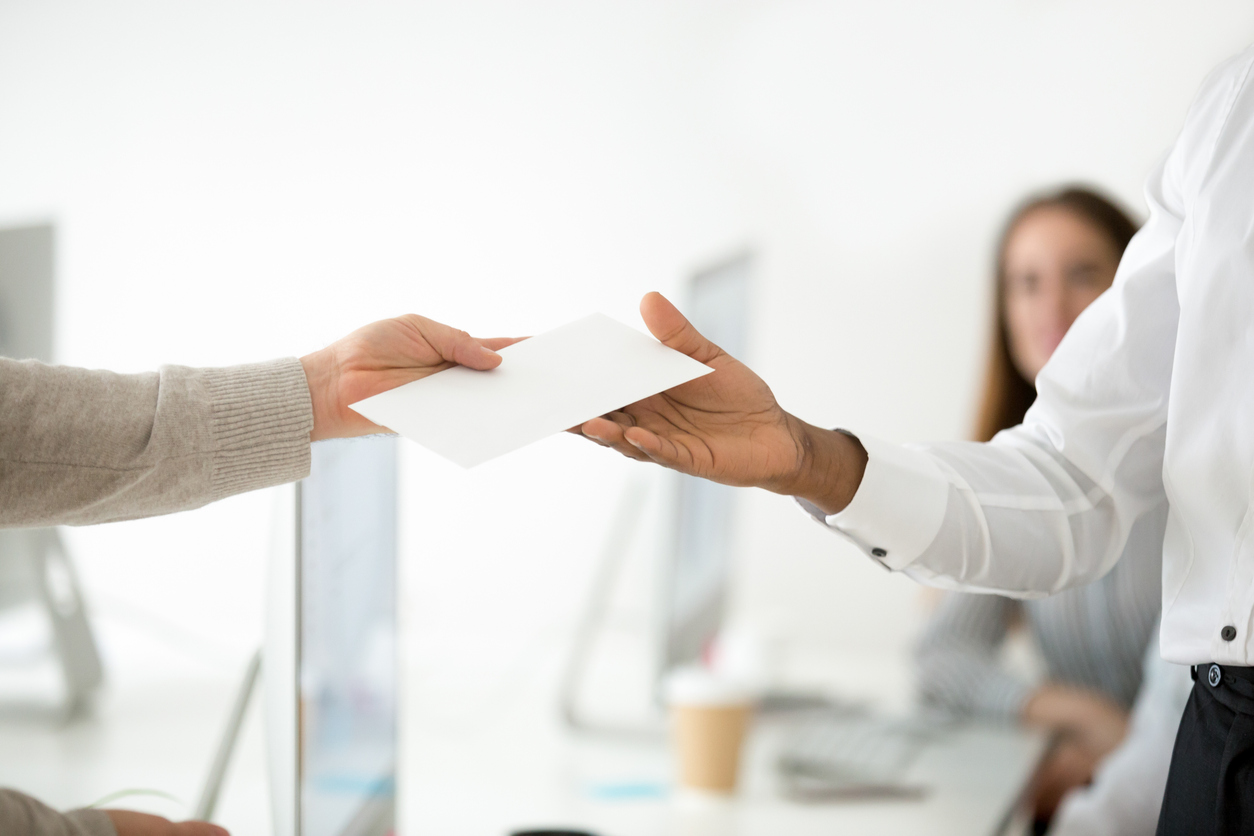 Employee handing in resignation letter