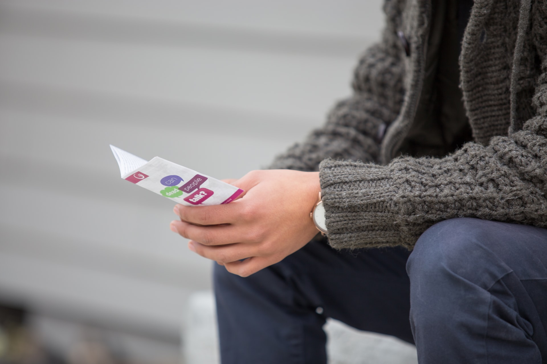 Man reading pamphlet