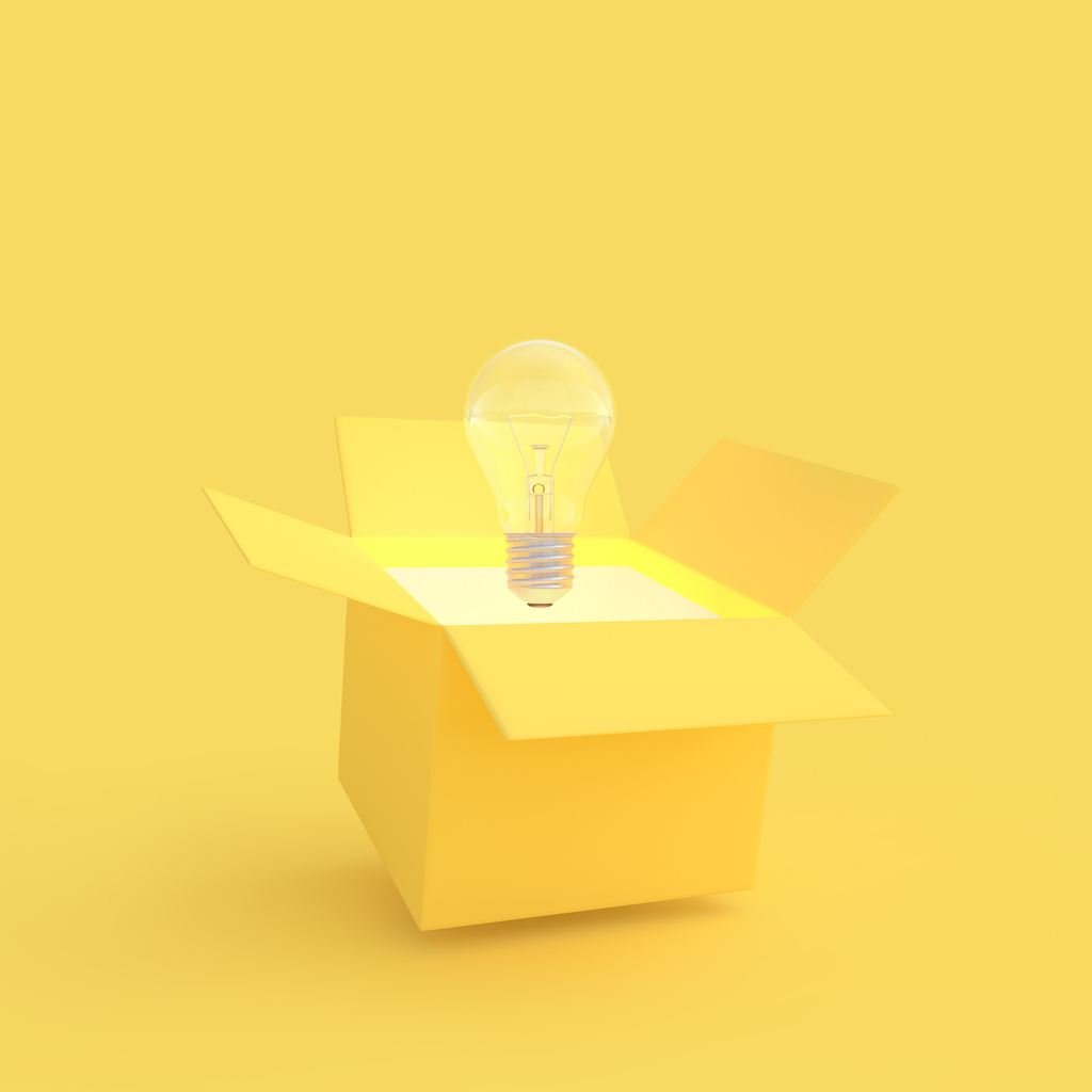 The light bulb drifted out of the gift box yellow color with clipping path. New idea and innovation concept and minimal style, 3D Render.