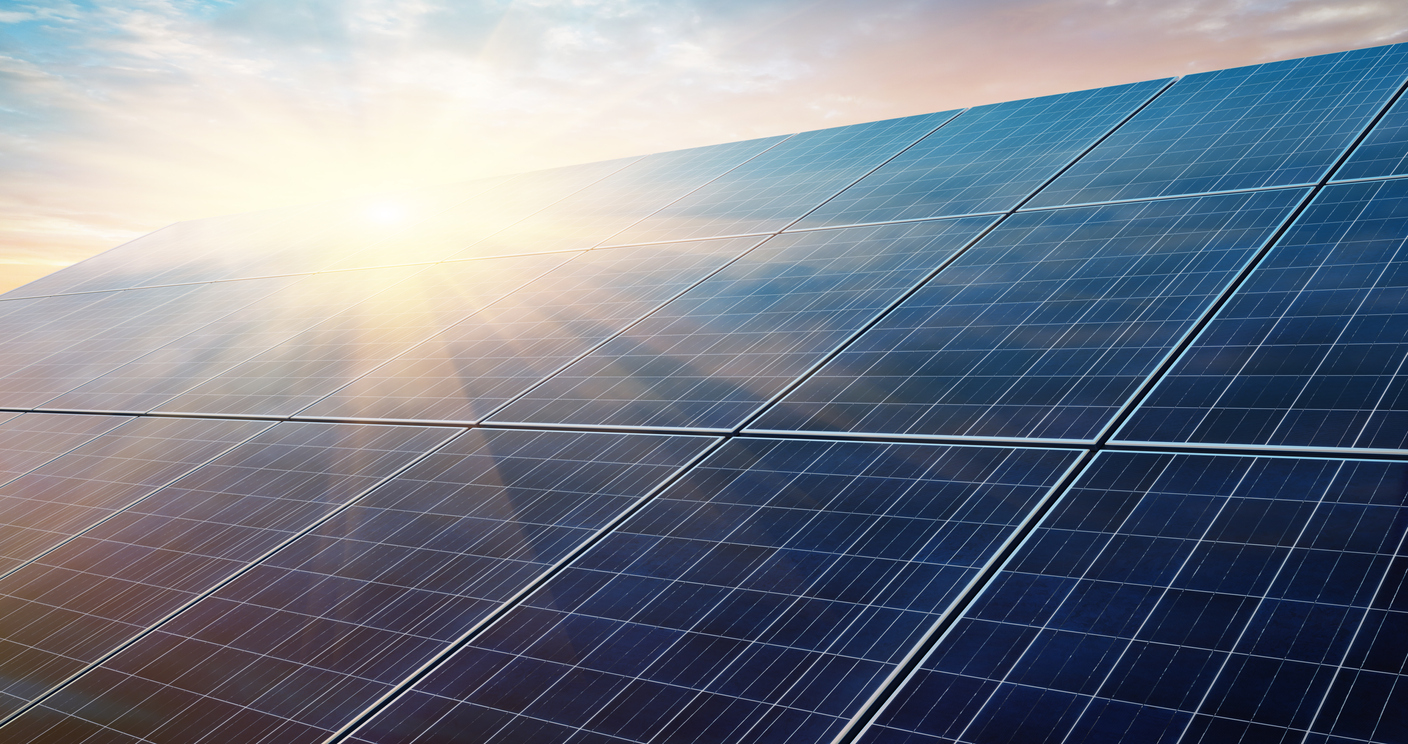 Photovoltaic system in front of a bright sunrise morning sky