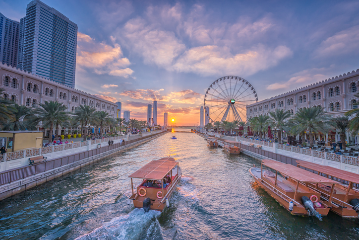 eye of the emirates ferris wheel in al qasba shajah at sunset