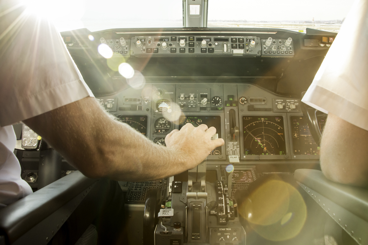 Captain is starting increasing thrust to take off. Departure is during sunset.